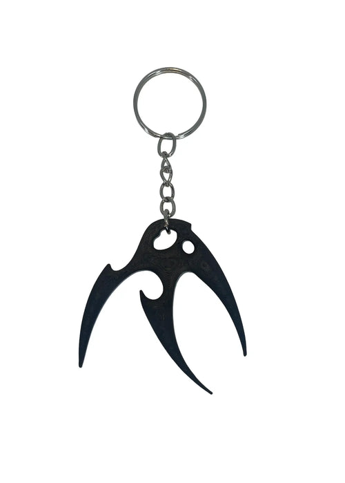 Black keychain with a unique design on a white background