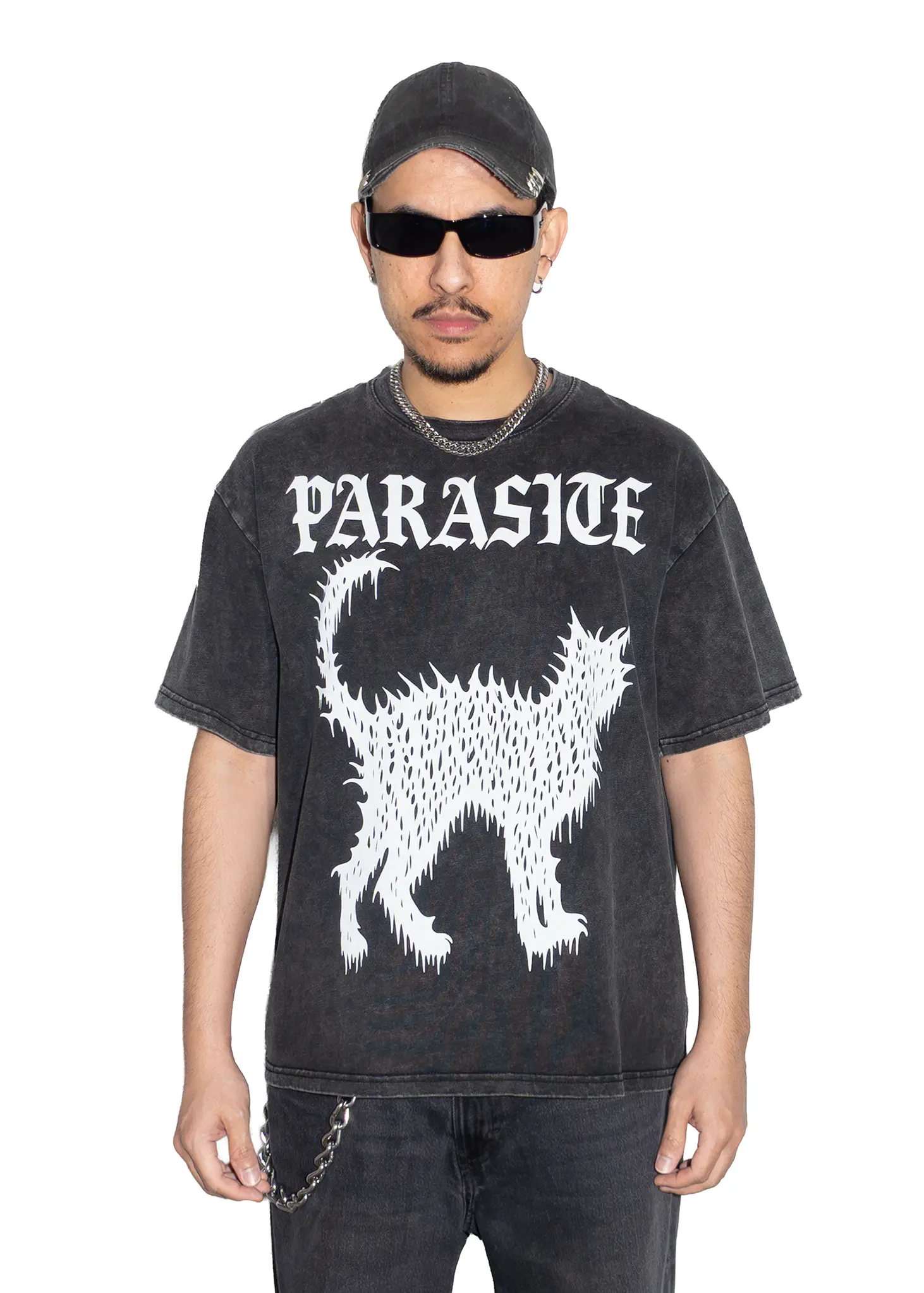 Person wearing a black t-shirt with Parasite Label text and Slime Cat graphic design on a white background