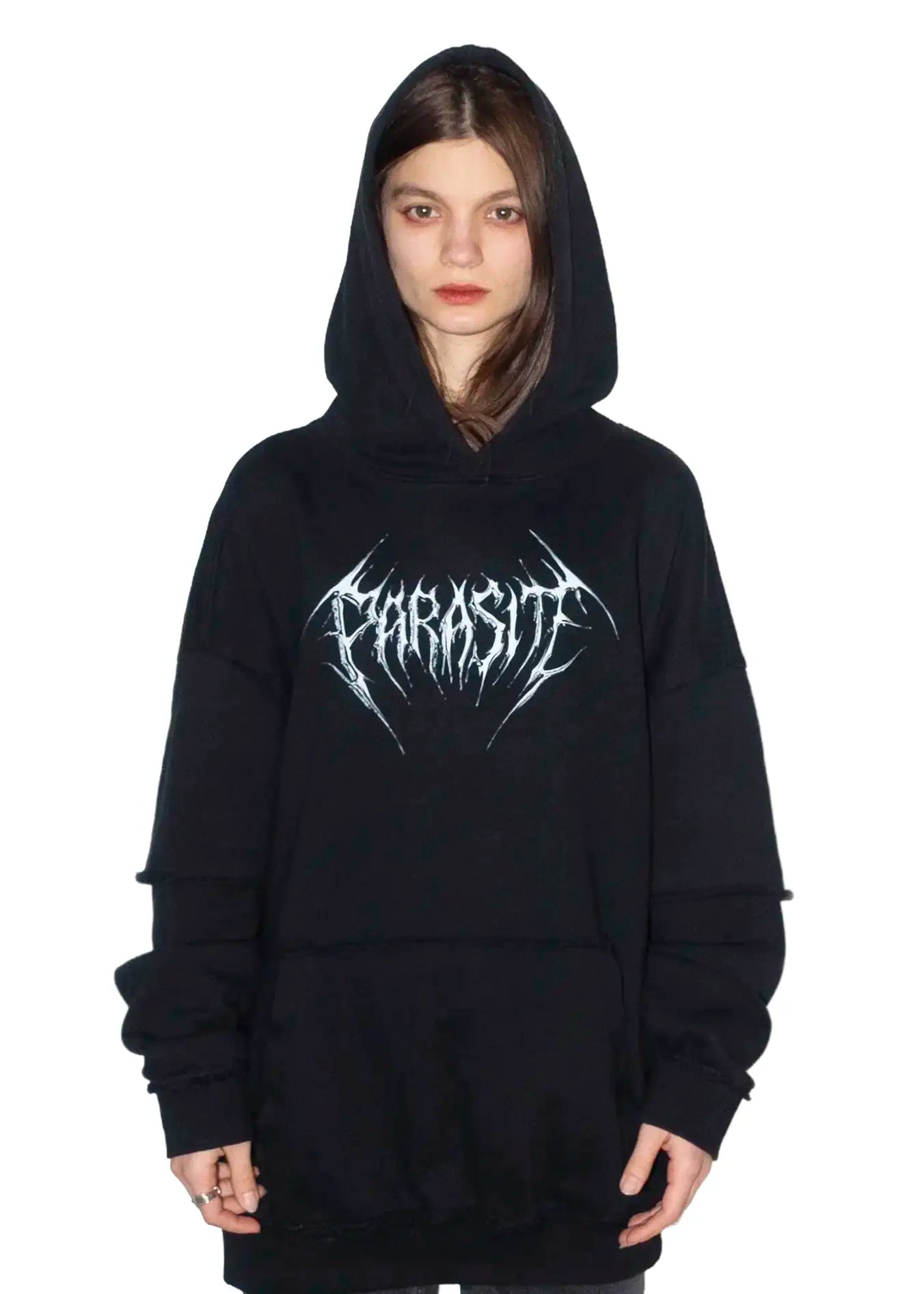 Person wearing a black hoodie with 3D chrome Parasite Label logo on a white background